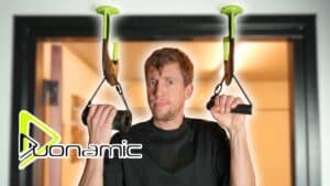 Man is hanging on the donamic eleviia portable pull up bars