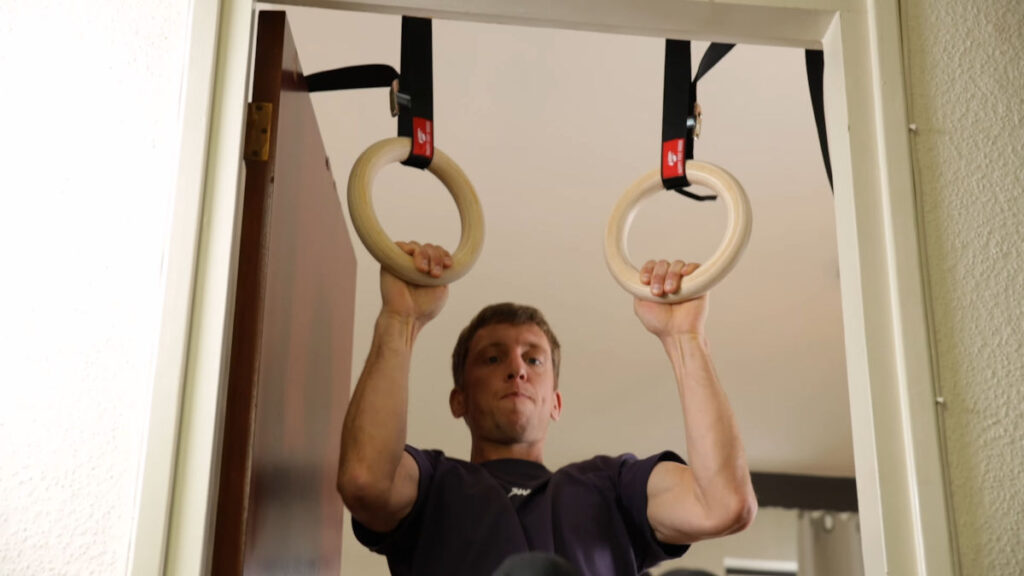 Jelle doing a Pull-Up on the Happy Fat Rings in a doorway