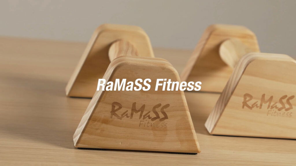 Close up of the RaMaSS fitness mini parallettes with the company logo etched on the sides.