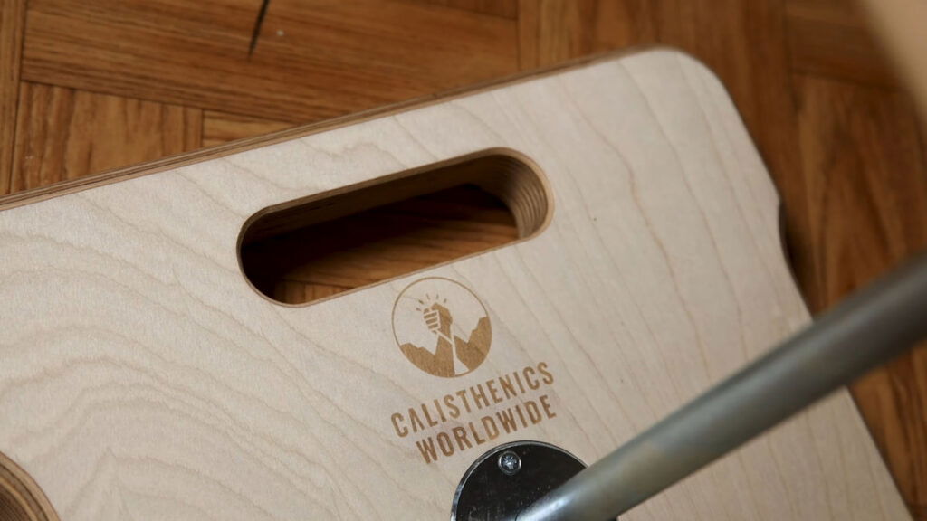 The base plate of the Compact Gorletic Handstand Canes showing the Calisthenics Worldwide logo etched on its surface.