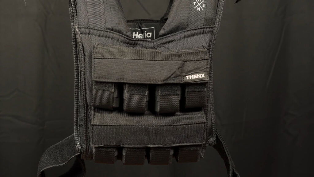 ThenX Weighted Vest front display hanging over a bar.