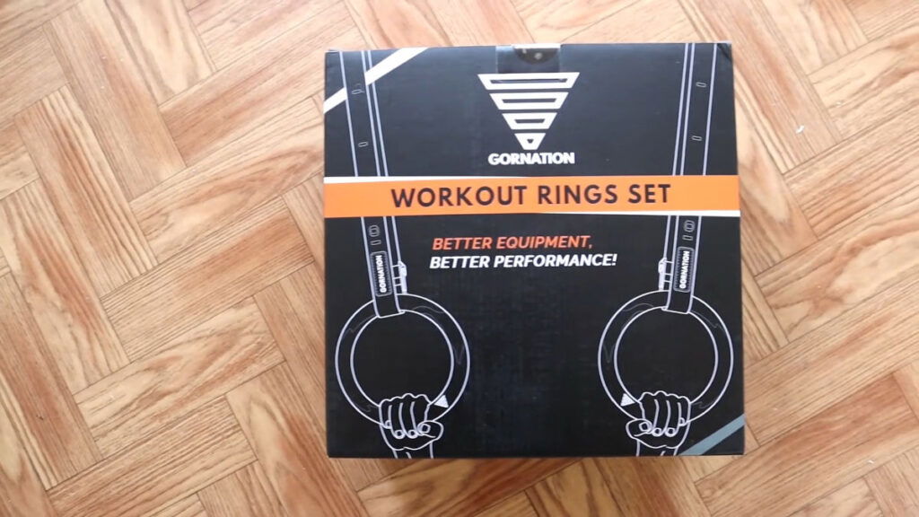 Front view of the box for the Gornation Gymnastic Rings including the text "workout rings set" and an abstract depiction of two hands each grabbing a Gornation Gymnastic Ring.