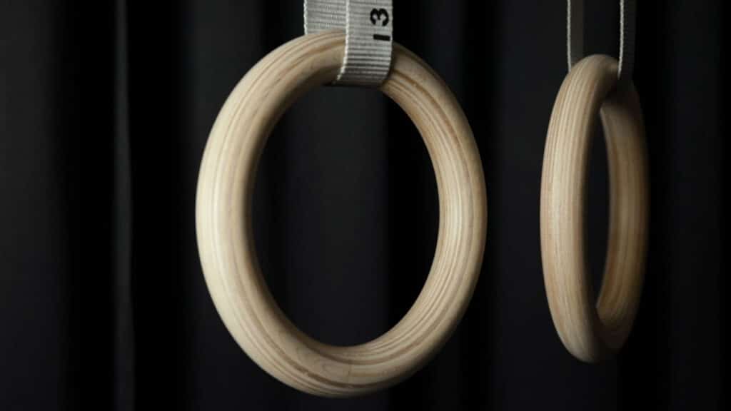 Close up of the Gorletic Gymnastic Rings hanging side by side and showing the crisp laminate wood grain.