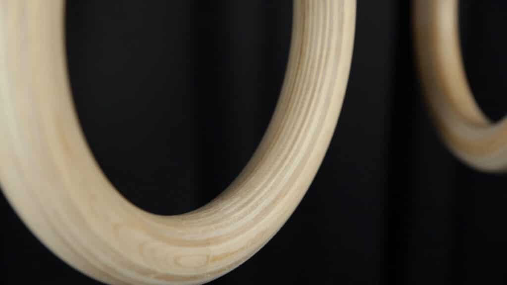 Close up of the Gorletic Gymnastic Rings showing the crisp wood grain of its laminate.