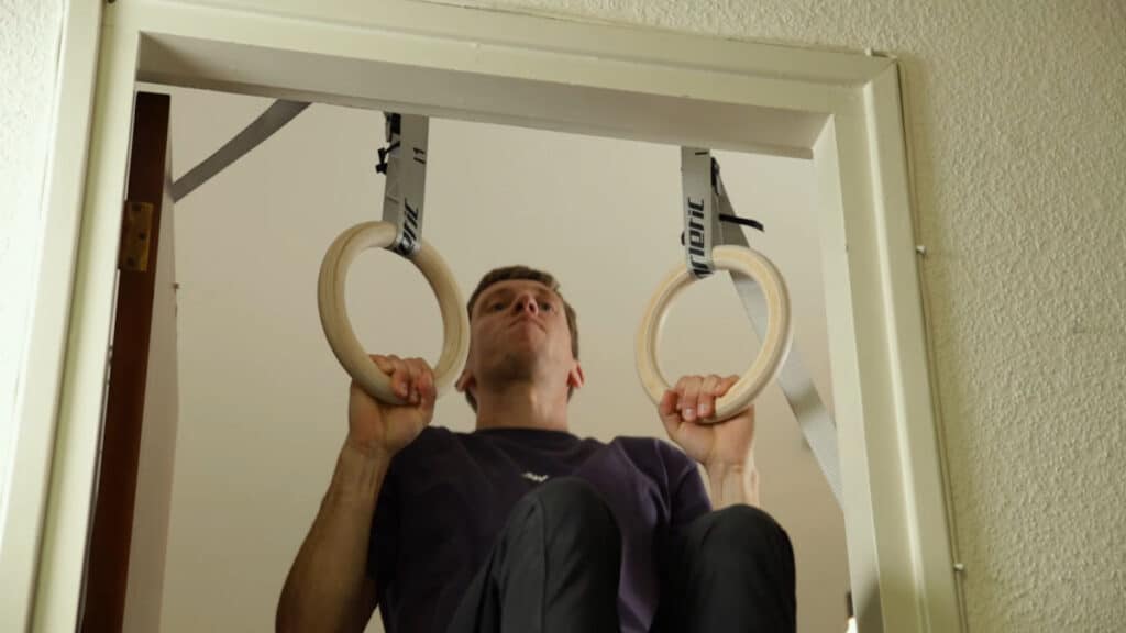 Man in violet shirt performing a Pull-Up on the Gorletic Gymnastic Rings.