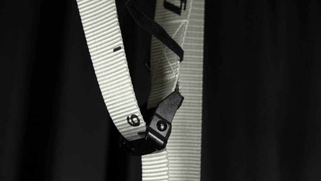 Close up of the black buckle with a strap running through it of the Gorletic Gymnastic Rings.