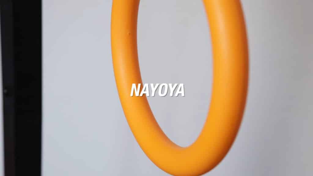 Close up of one of the Nayoya Gymnastic Rings with the brand name displayed in the middle.