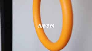 Close up of one of the Nayoya Gymnastic Rings with the brand name displayed in the middle.