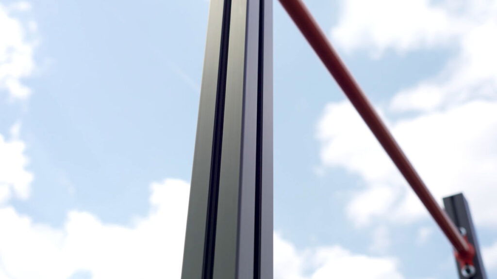 Close up of a beam of the FitnessKit Basic Strength Bar showing the parallel slots for guiding in the top bar and other bars, seamlessly.