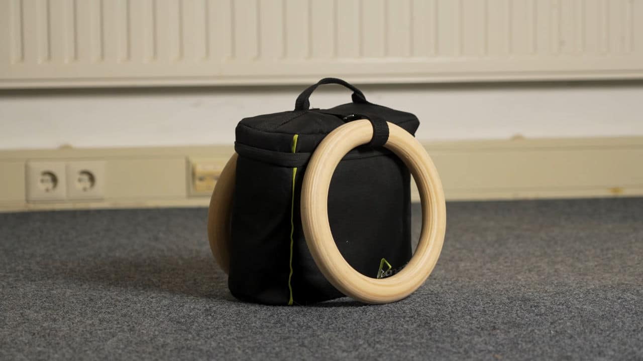 The carry bag for the Duonamic Eleviia door pull-up handles with two Duonamic Gymnastic Rings hanging off the sides.