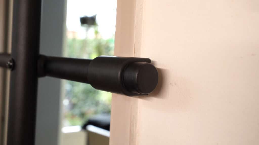 Close up of the rubber foot one of the bracing bars of the Pullup & Dip Doorway Dip Bar that rests against the door frame.