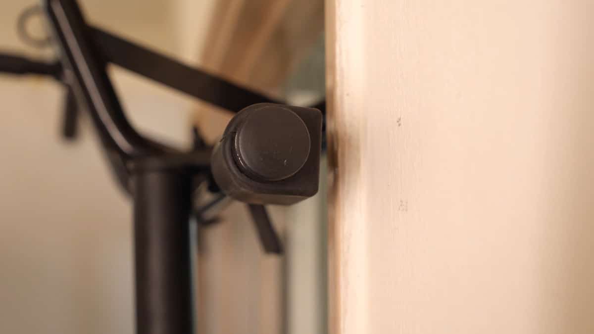 The upper bracing bar of the Pullup & Dip Doorway Dip Bar coming off the doorframe when it's hanging on the Pullup & Dip Doorframe Pull-Up Bar.