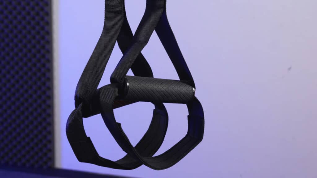 Detail of the hard rubber handles and padded foot loops of the streetgains suspension trainer.