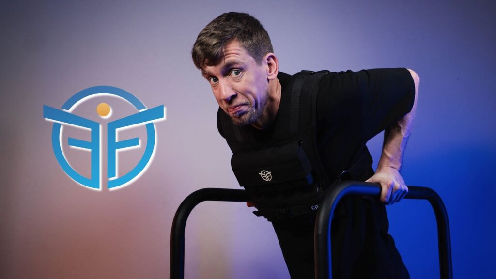 Man in black shirt doing dips on the eric flag dip bars while looking questionable at the viewer.