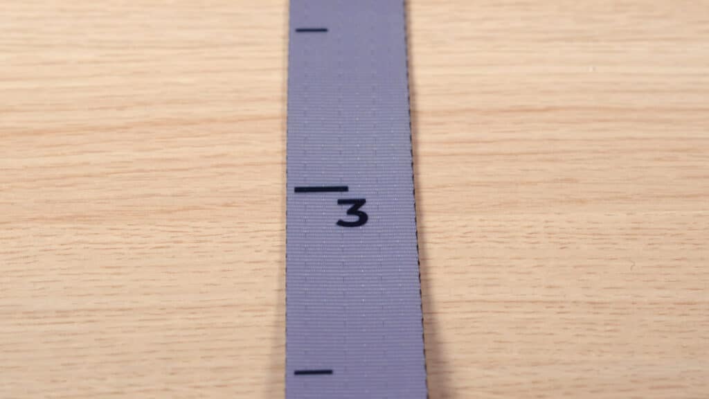 Detail of one of the MARMATI standard straps, showing the numbers and markings that make levelling the Marmati Gymnastic Rings easier.