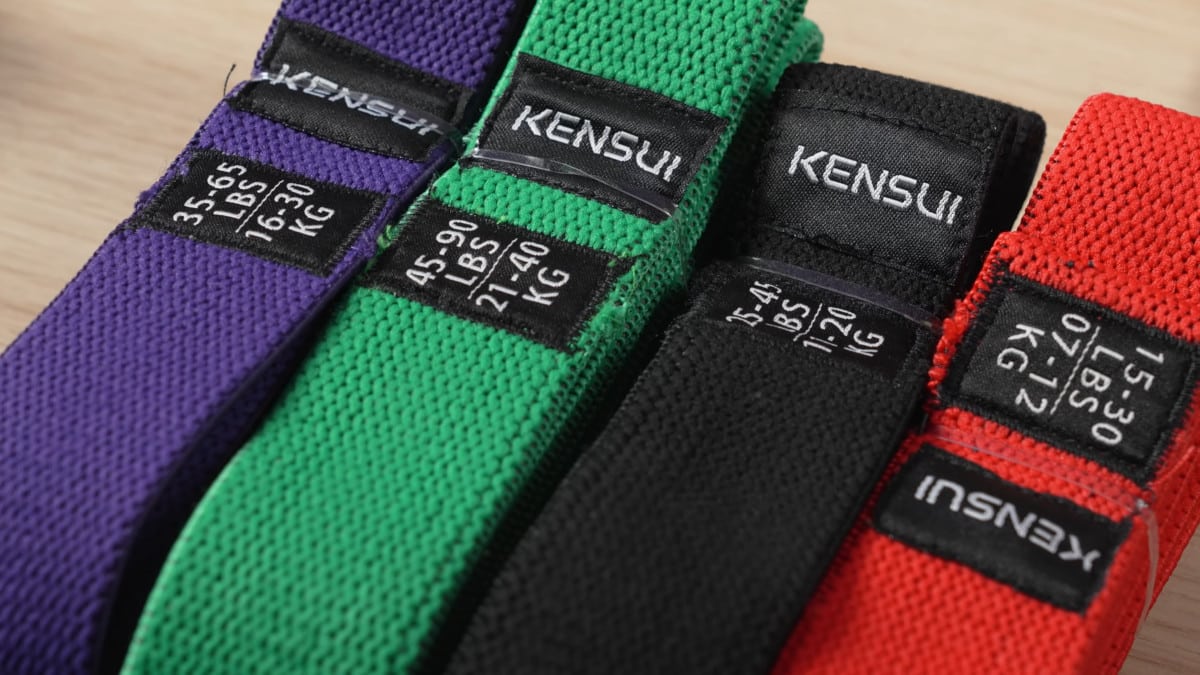 Close up on four colors and weights of kensui fabric resistance bands.