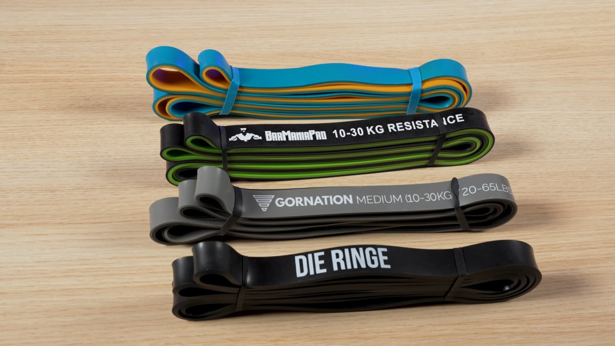 Four medium resistance bands side by side by barmania pro, gornation and die ringe.