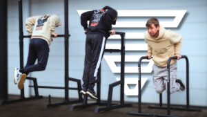 Three GORNATION Dip Bars versions side-by-side each occupied by a man doing dips on them.