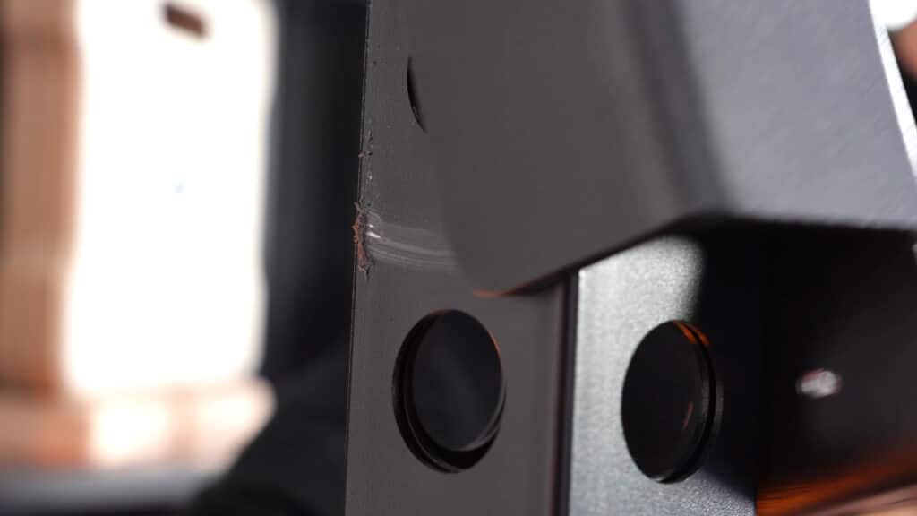 Close up of the the barbell hooks on a kensui fitness torii rack, showing that the tight fit might damage the coating.