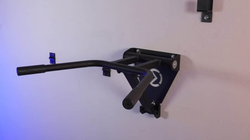The StreetGains wall-mounted dip bars extended from the wall and ready for use.