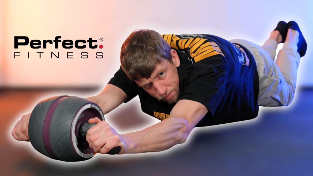 Man in black shirt doing an ab rollout on the Perfect Fitness Ab Carver Pro while looking suspiciously as the camera.