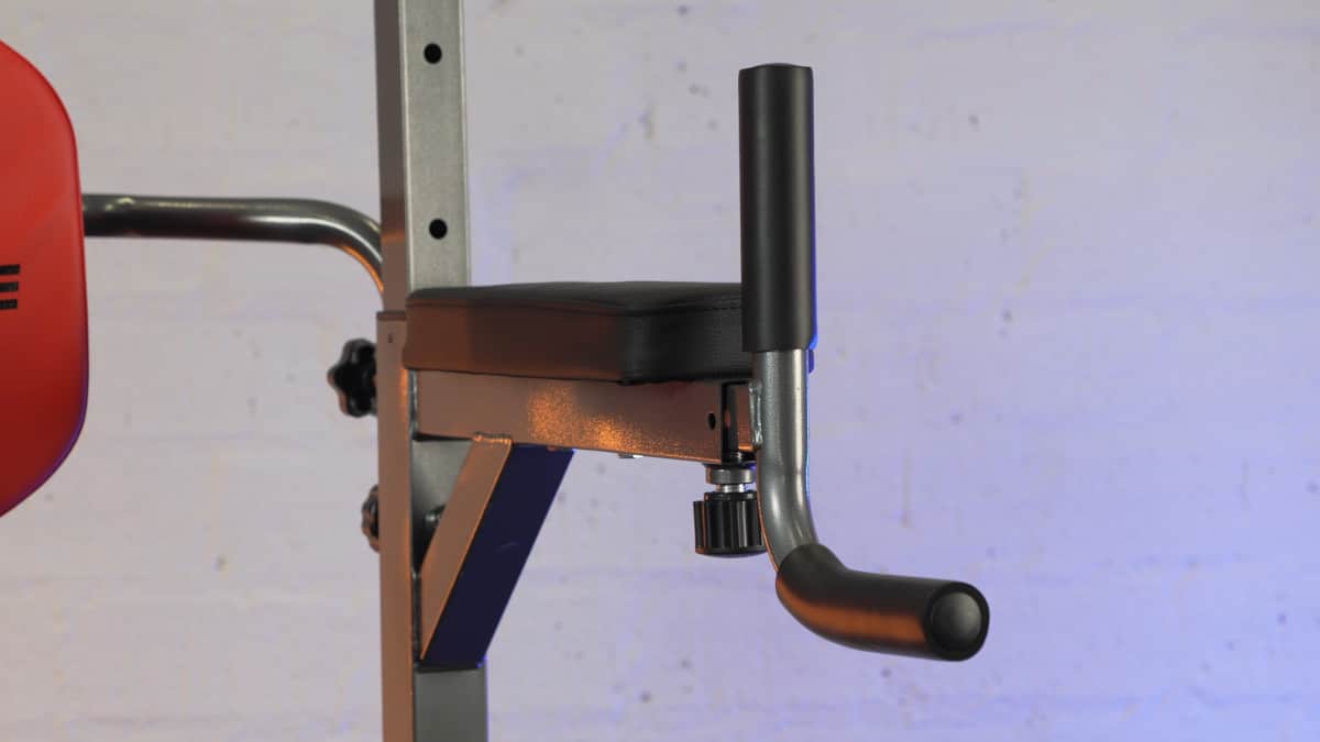 An arm rest and dip handle on the relife power tower.