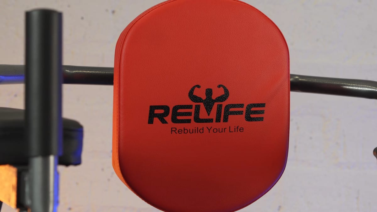 View of the red backrest of the relife power tower with the relife rebuild your life logo printed on it in black.