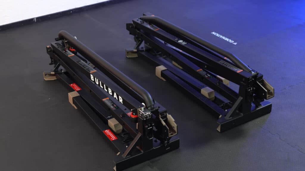 The bullbar 2.0 extended and standard version folded up and lying side by side on the floor.