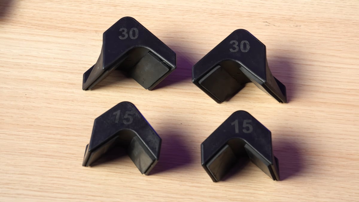 A set of angle modifiers belonging to the kensui swissies v2 series, both the 15 and 30 degree attachments.