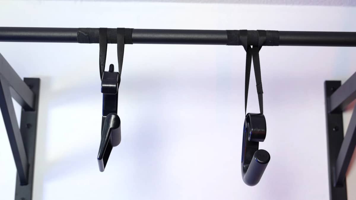 Two different versions of the kensui swissies attached to rotator bands and suspended from a pull-up bar.