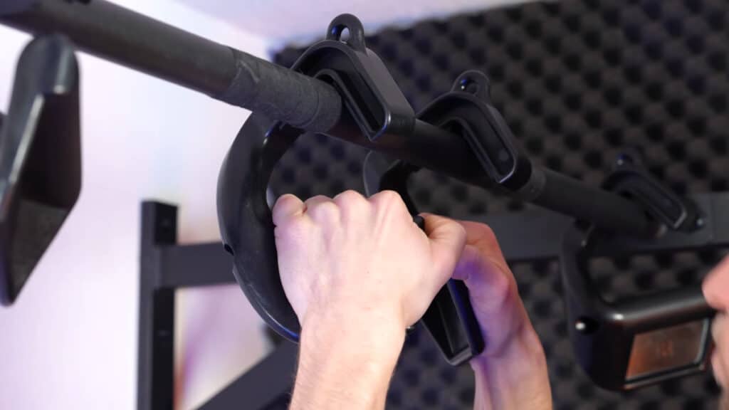 Close up of a man doing pull-ups on the kensui swissies v2 max p