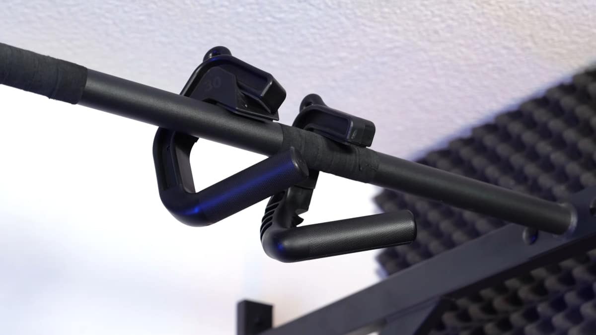 A pair of kensui swissies v2 sp hanging from a gornation pull-up bar, one with an angle modifier attached.