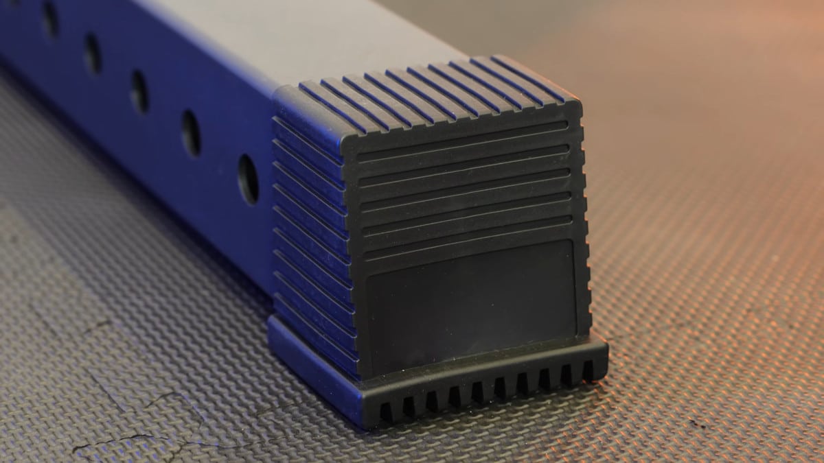 Detail of the thick, blocky rubber end caps on the feet of the king of weighted adjustable dip station.