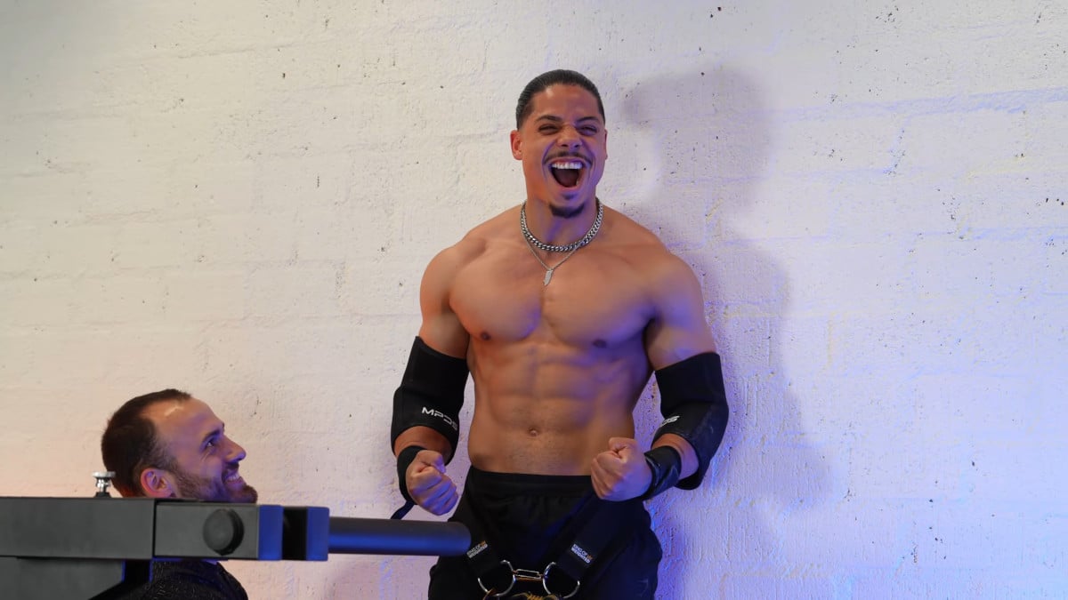 Jurvin Valdez visible excited after dismounting a king of weighted adjustable dip station.