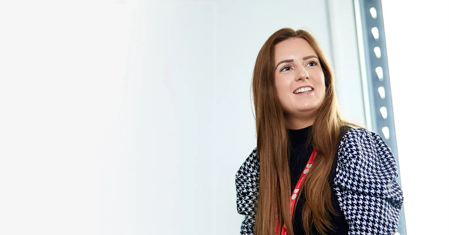 A woman wearing an Oury Clark lanyard