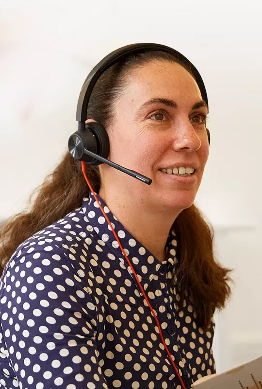 A woman wearing a hands-free headset
