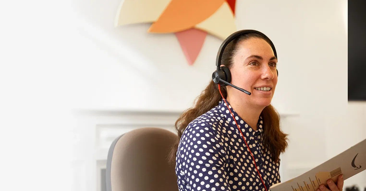 A woman wearing a hands-free headset