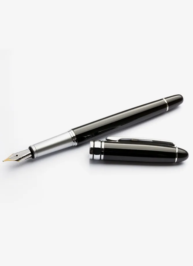 A photo of a black and silver fountain pen, its lid resting next to it