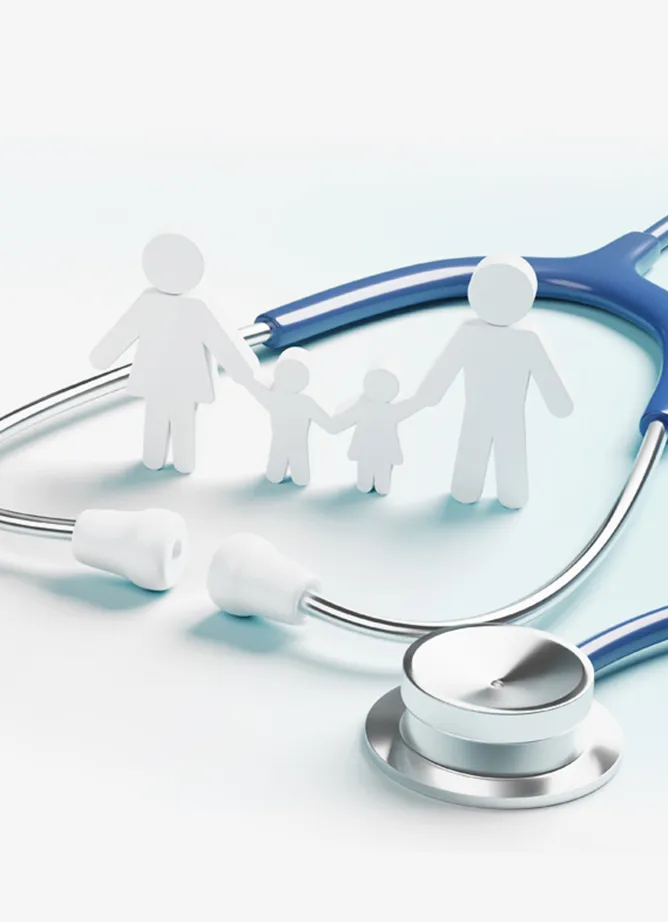 Paper cuts out of a two parent, two child family stands inside a doctor's stethoscope