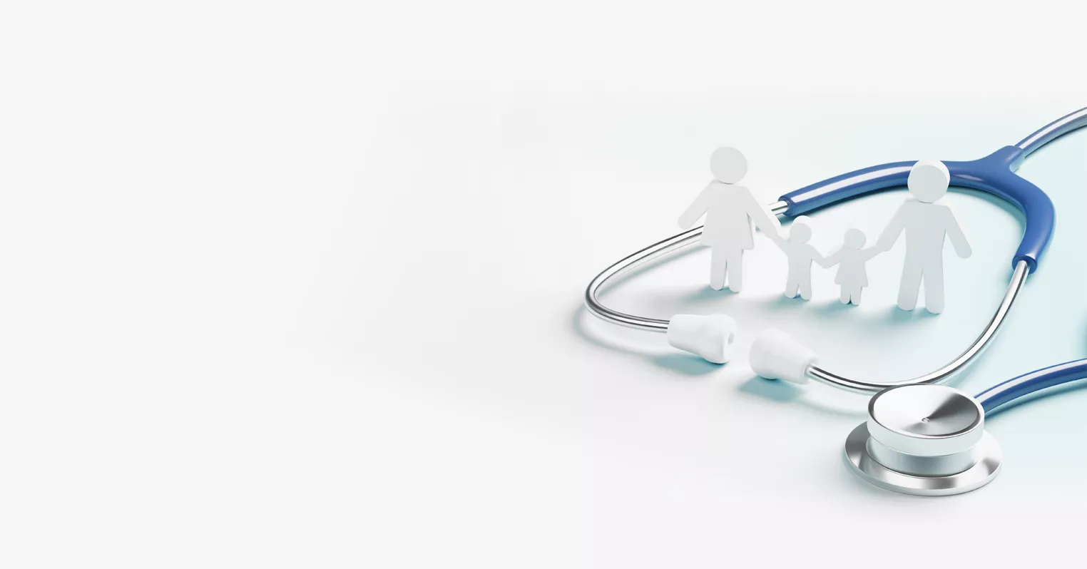 Paper cuts out of a two parent, two child family stands inside a doctor's stethoscope