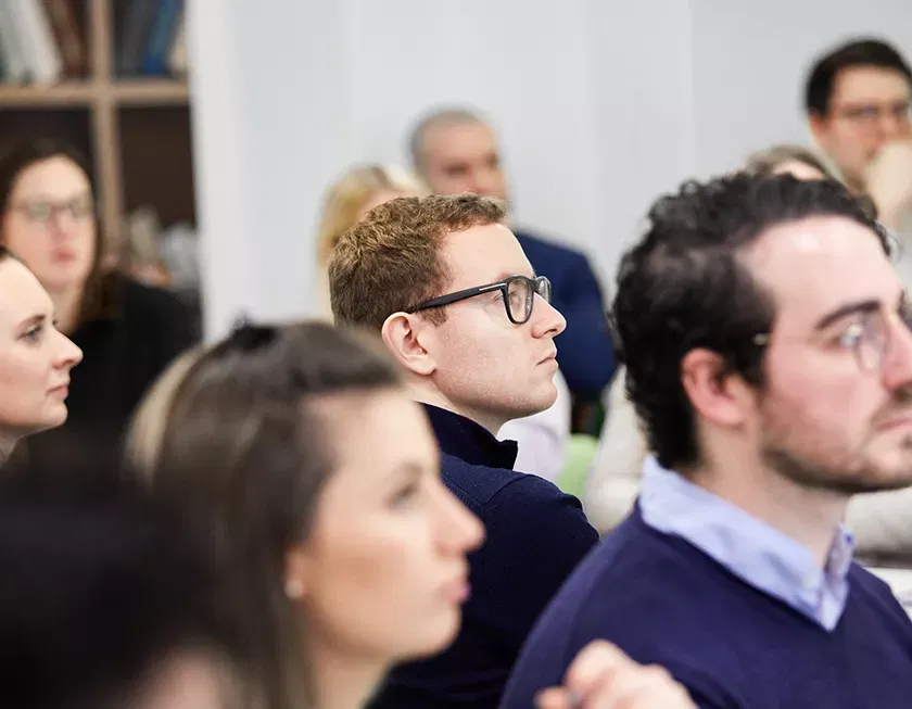 Photo showing a group of people watching something